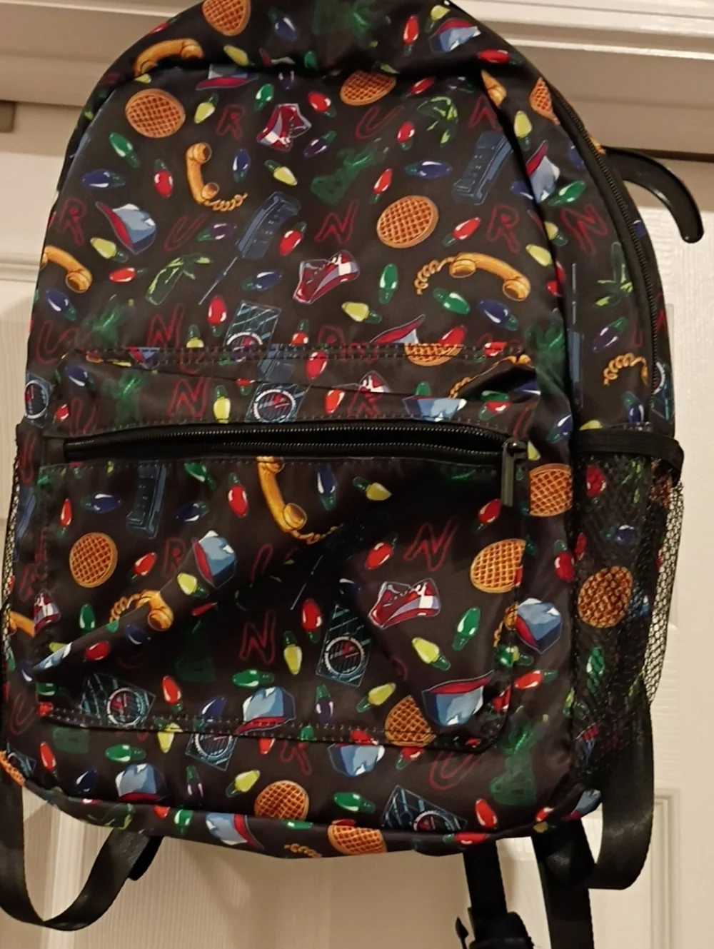 Black Patterned Backpack with Multicolor Accents